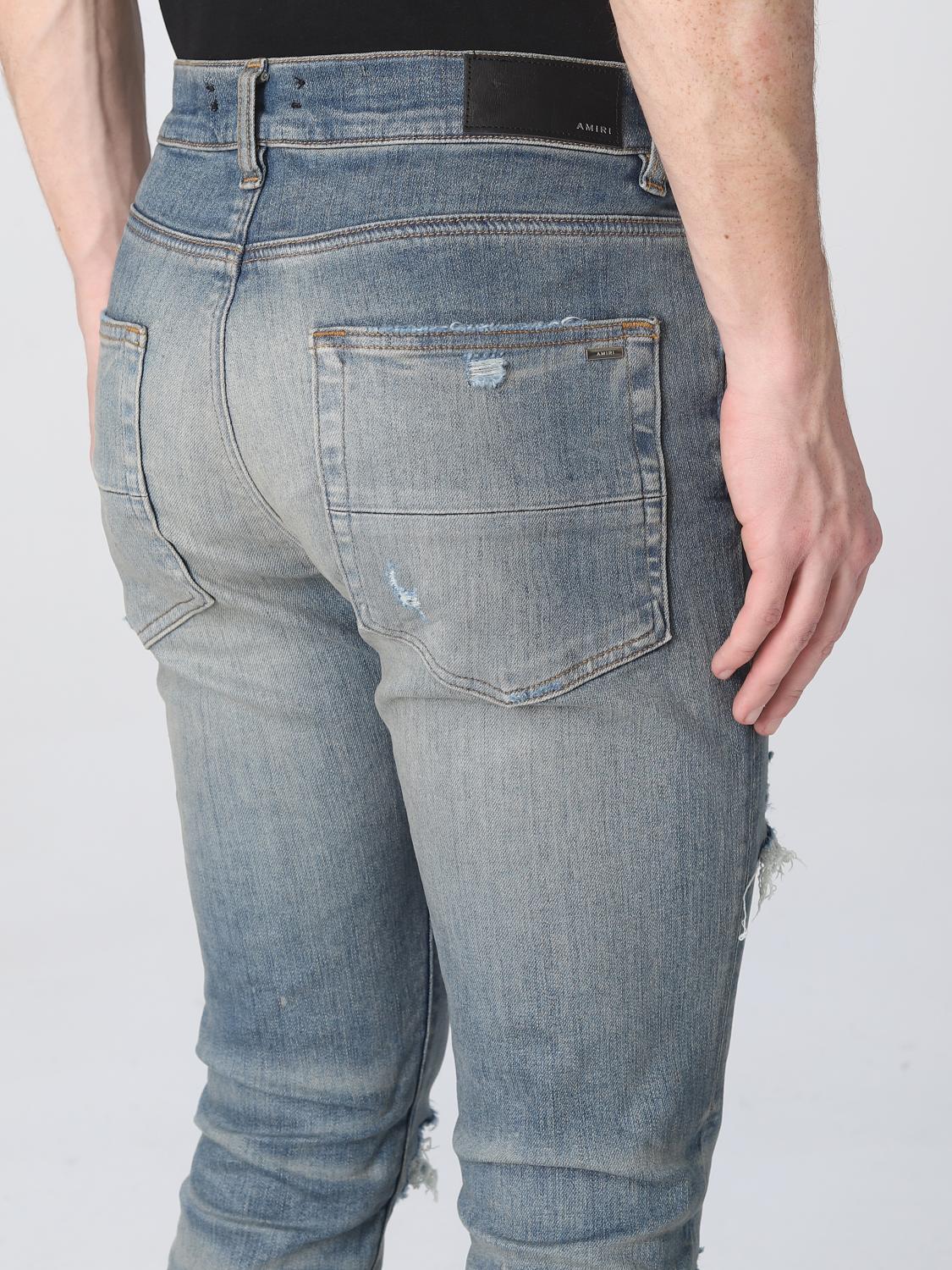 Clay indigo Amiri Thrasher Plus slim-fit jeans with five-pocket construction, back view by Amiri