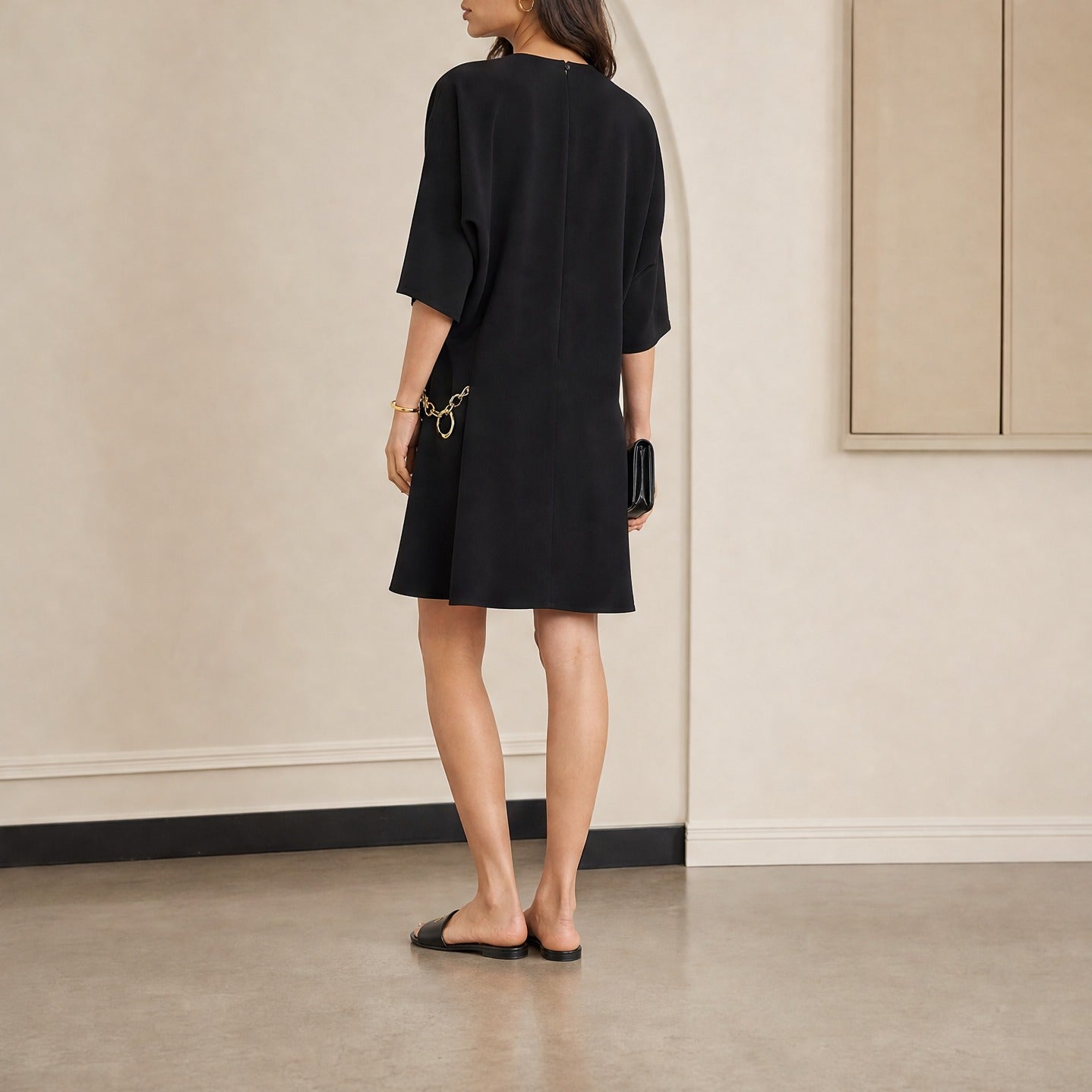 Black Celine Cady dress back button closure and slit detail, close-up back