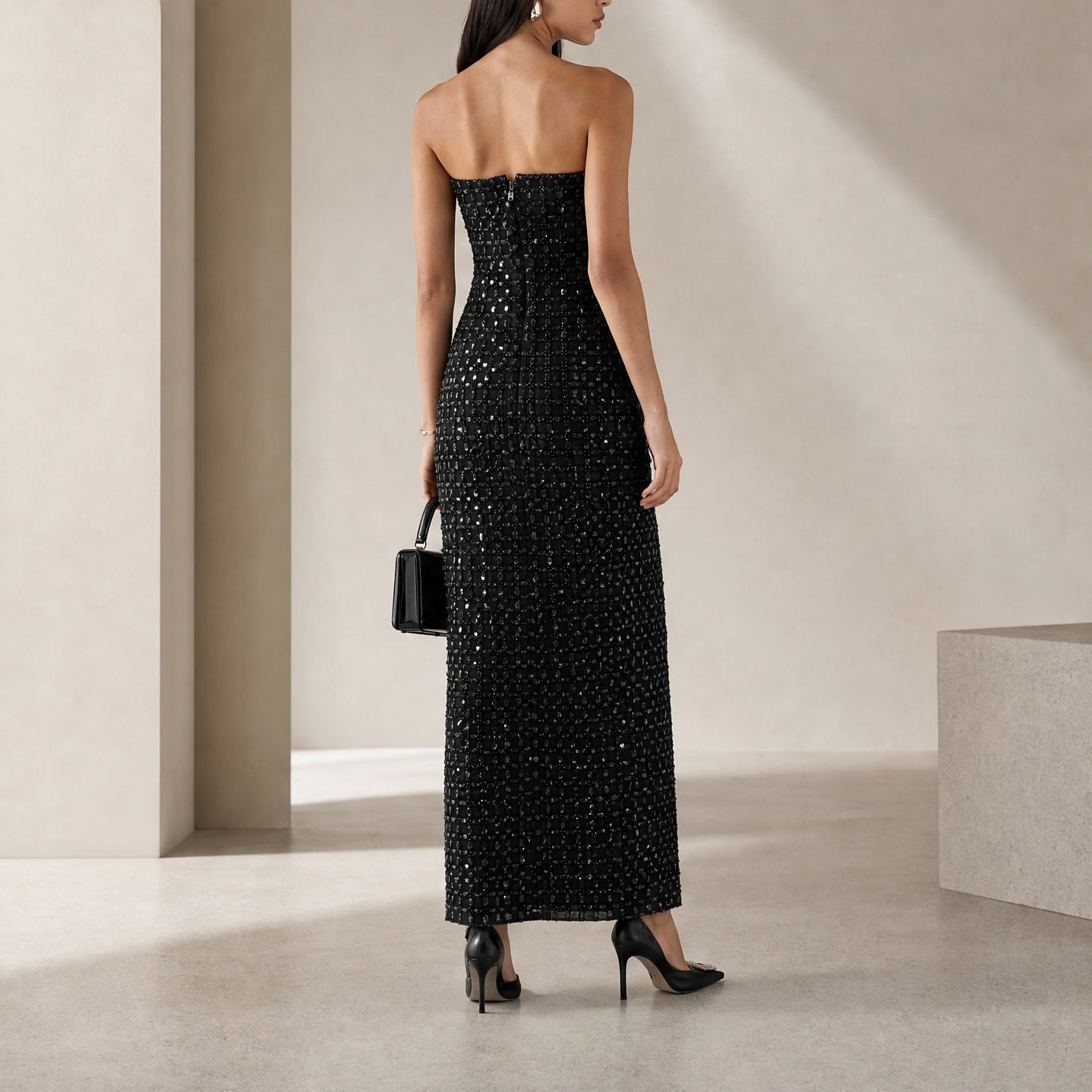Black beaded maxi dress back construction detail, close-up view by ROTATE BIRGERCHRISTENSEN