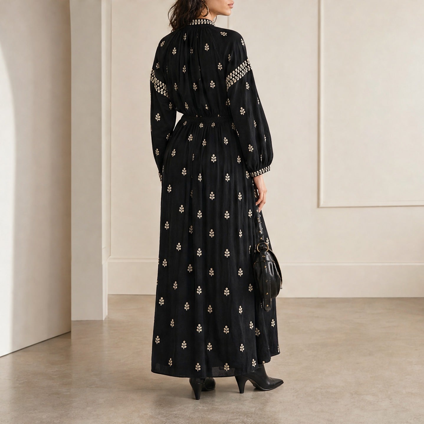 Black embroidered maxi dress back detail, close-up view