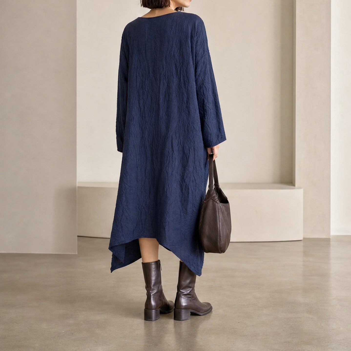 Black Spicchi midi dress showing asymmetrical hem by DANIELA GREGIS, back detail