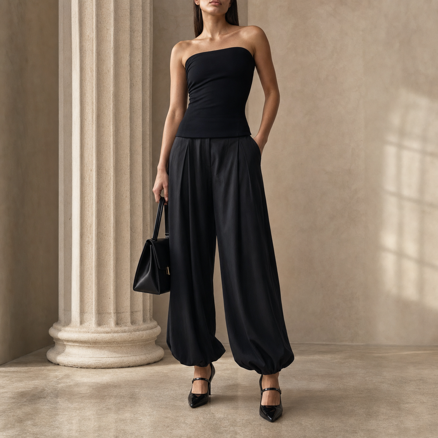 Black balloon-hem trousers with front pleats, close-up detail by Lord & Taylor Heritage