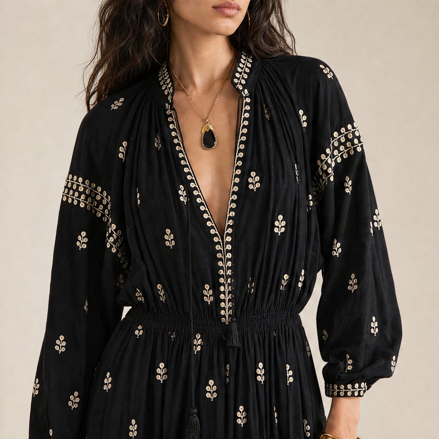 Black silk maxi dress embroidered neckline detail, close-up front
