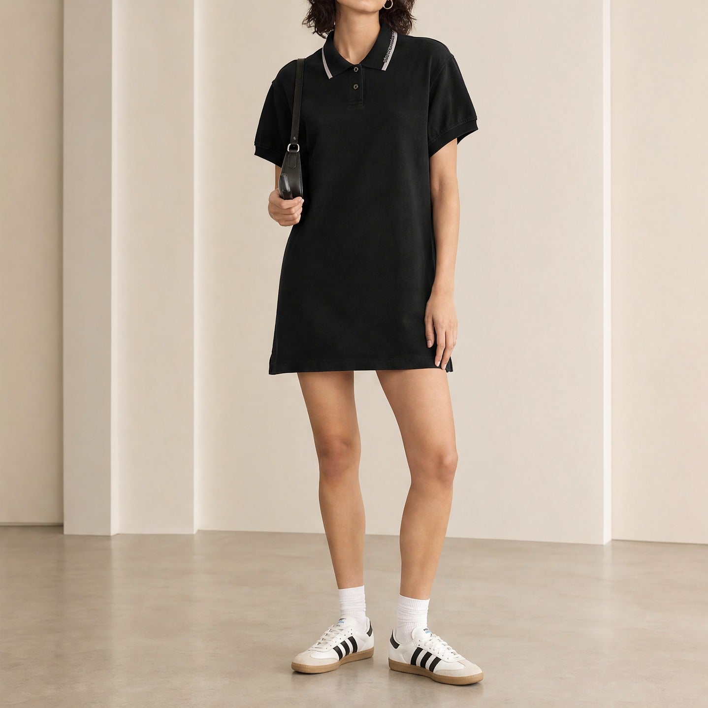 Black polo mini dress with oversize fit by T by Alexander Wang, full body view