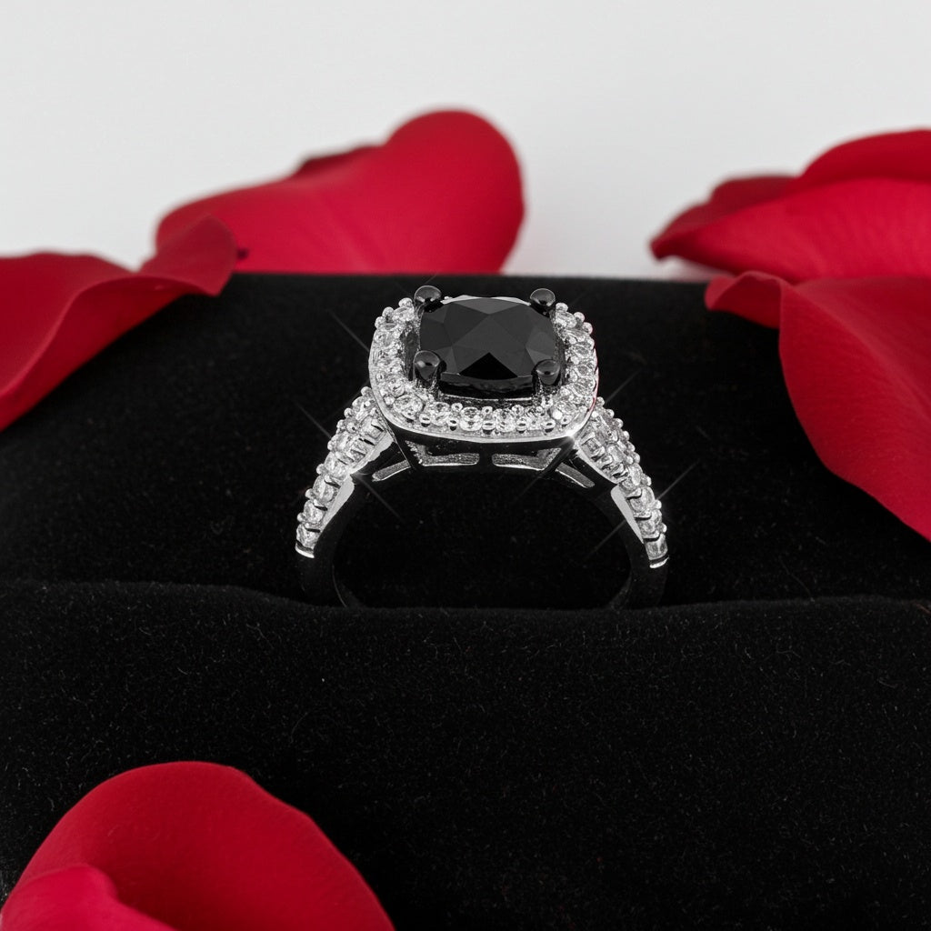 White gold black diamond halo ring with cushion cut center stone, top view by Lord & Taylor