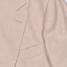 Papaya wool linen suit by Brunello Cucinelli, detail of two-button closure