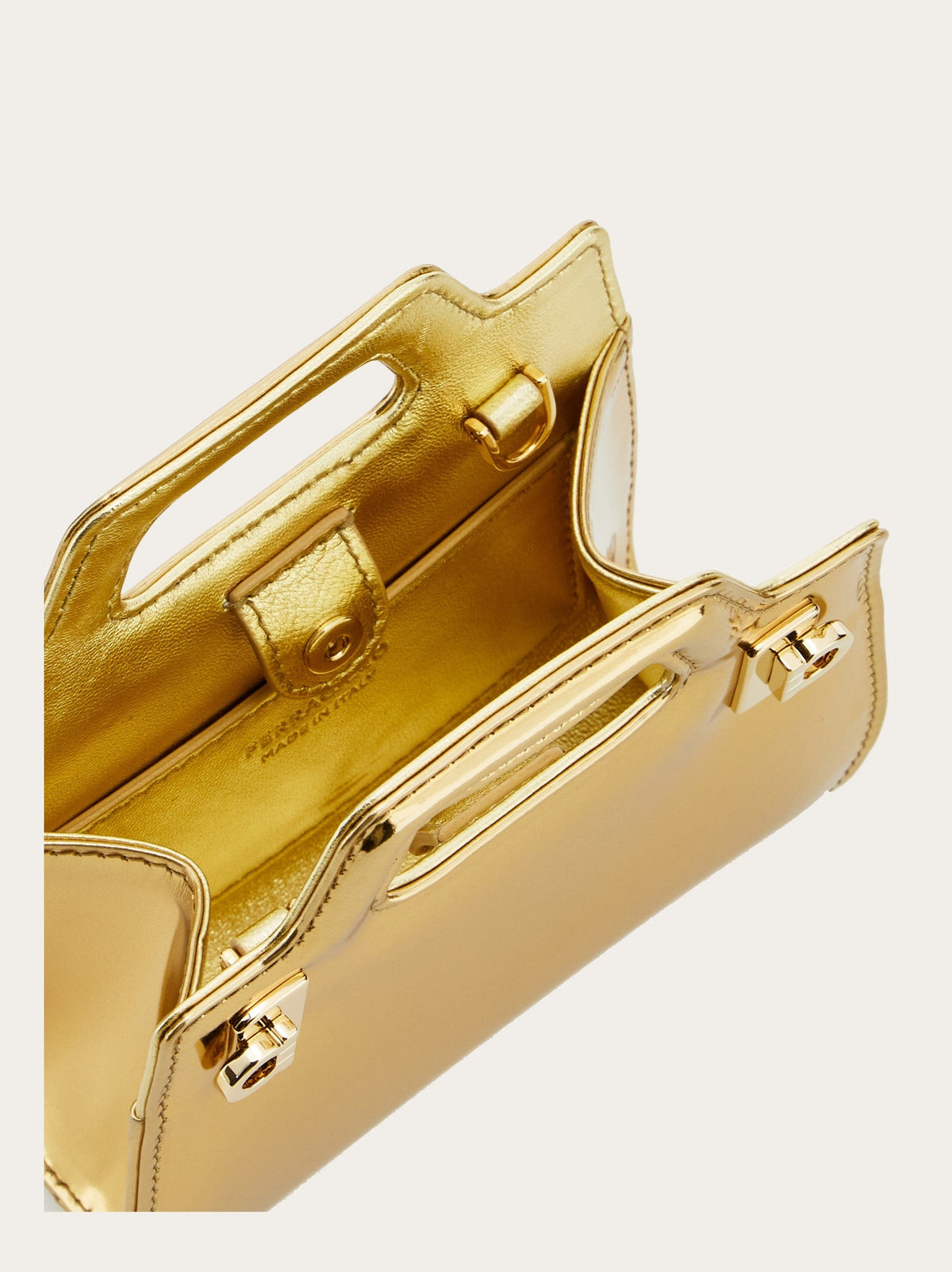 Metallic gold calfskin texture detail on Salvatore Ferragamo Wanda bag