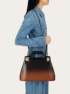 Salvatore Ferragamo top handle bag with sculptural cut-out handle, detail view