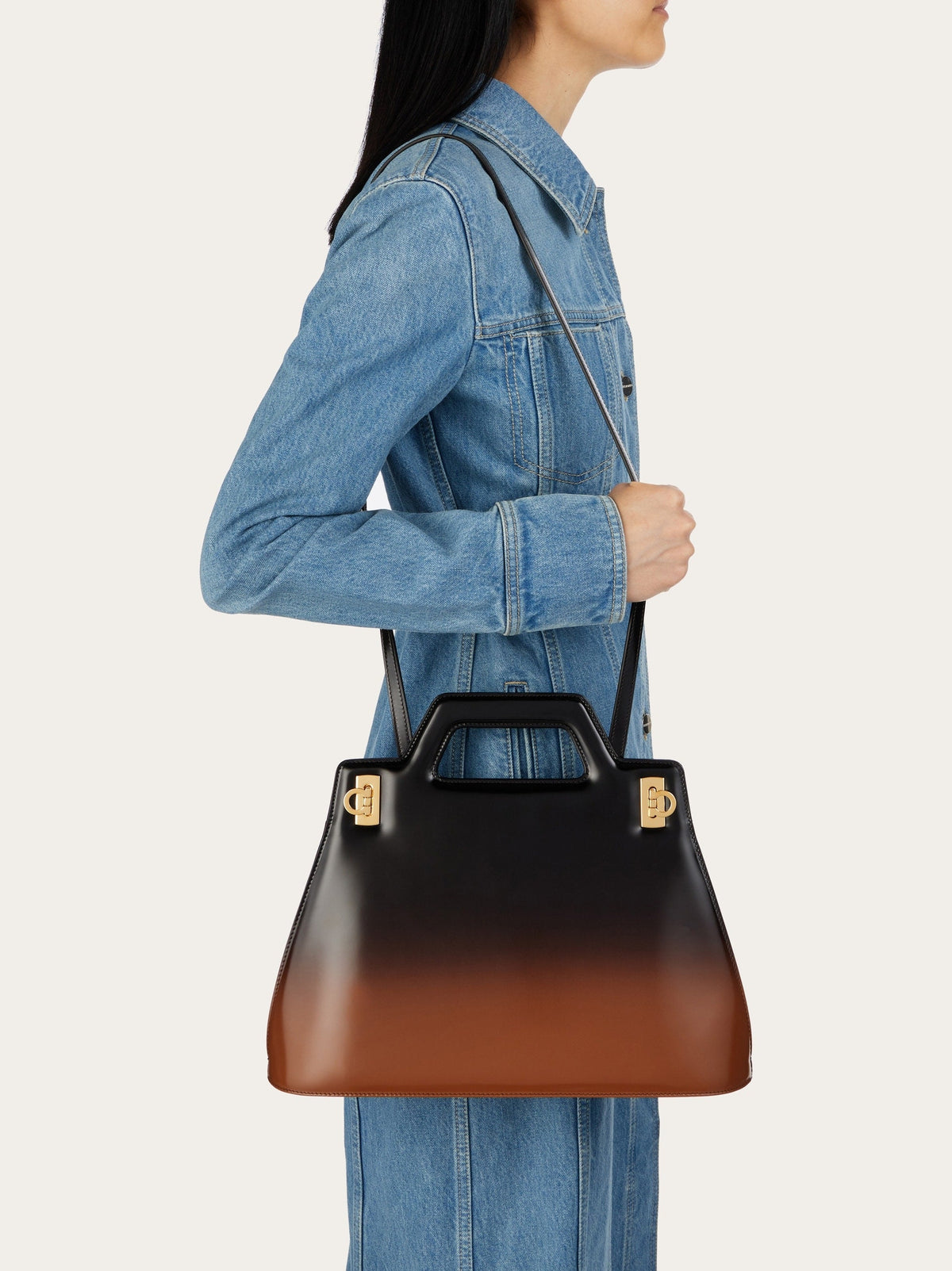 Salvatore Ferragamo top handle bag with sculptural cut-out handle, detail view