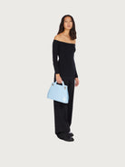 Light blue Salvatore Ferragamo top handle bag, side angle view