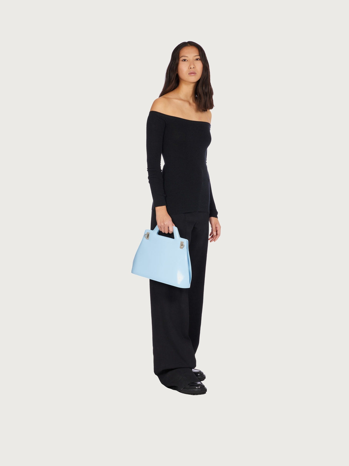 Light blue Salvatore Ferragamo top handle bag, side angle view