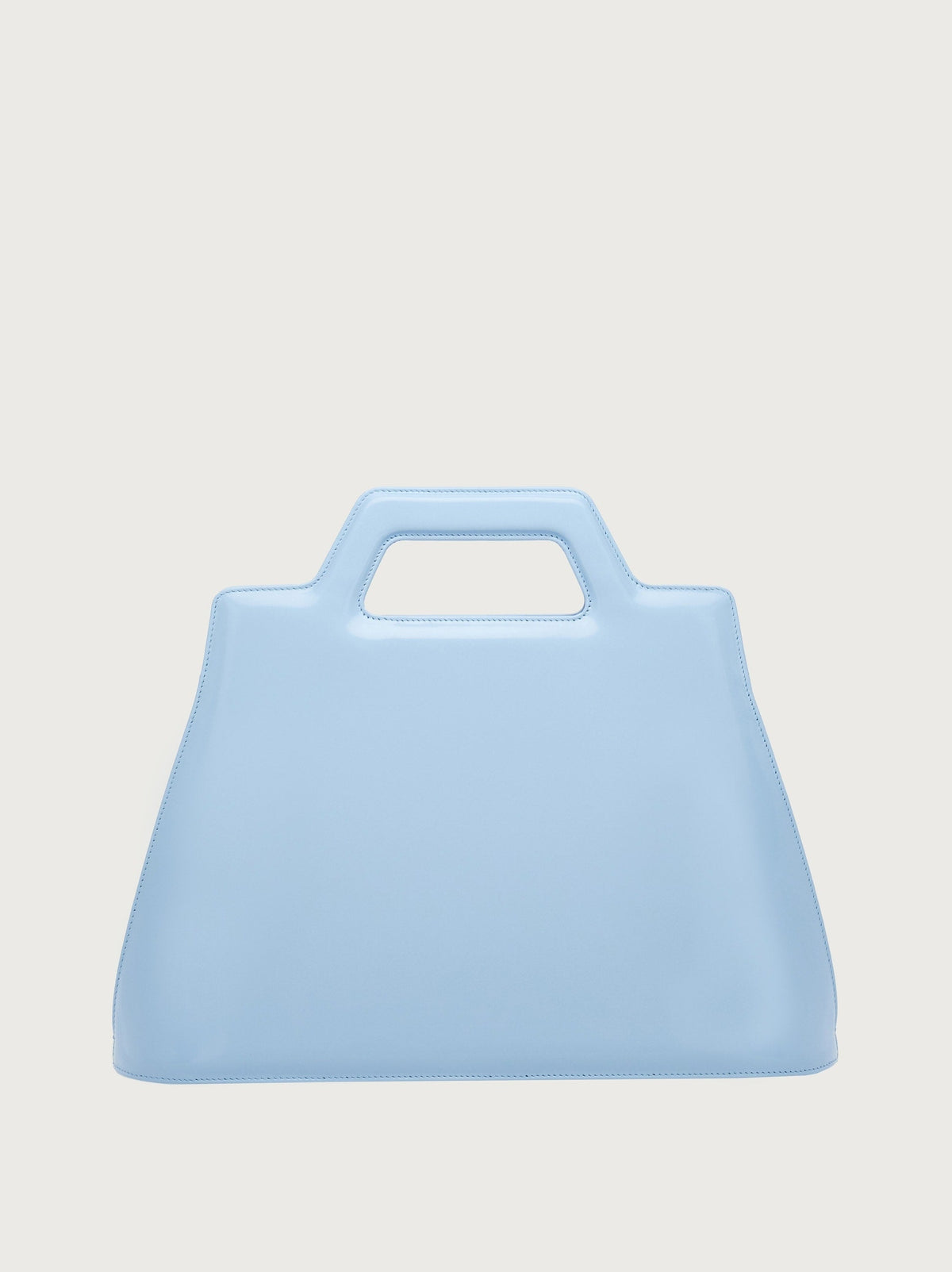 Light blue Salvatore Ferragamo bag showing dual turn-lock closure