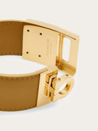 Salvatore Ferragamo tan leather bracelet showing rectangular buckle detail with Gancini emblem