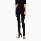 Black Salvatore Ferragamo knit set with long-sleeve top and stirrup leggings, front view