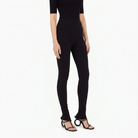 Black Salvatore Ferragamo knit set with crew-neck top and fitted leggings, back view