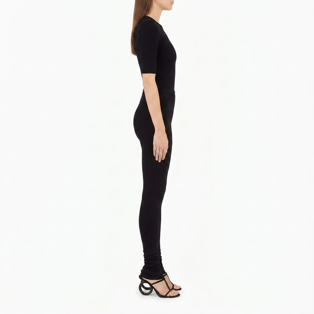Black Salvatore Ferragamo knit set showing stirrup-hem legging detail