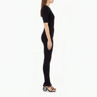 Black Salvatore Ferragamo knit set showing stirrup-hem legging detail