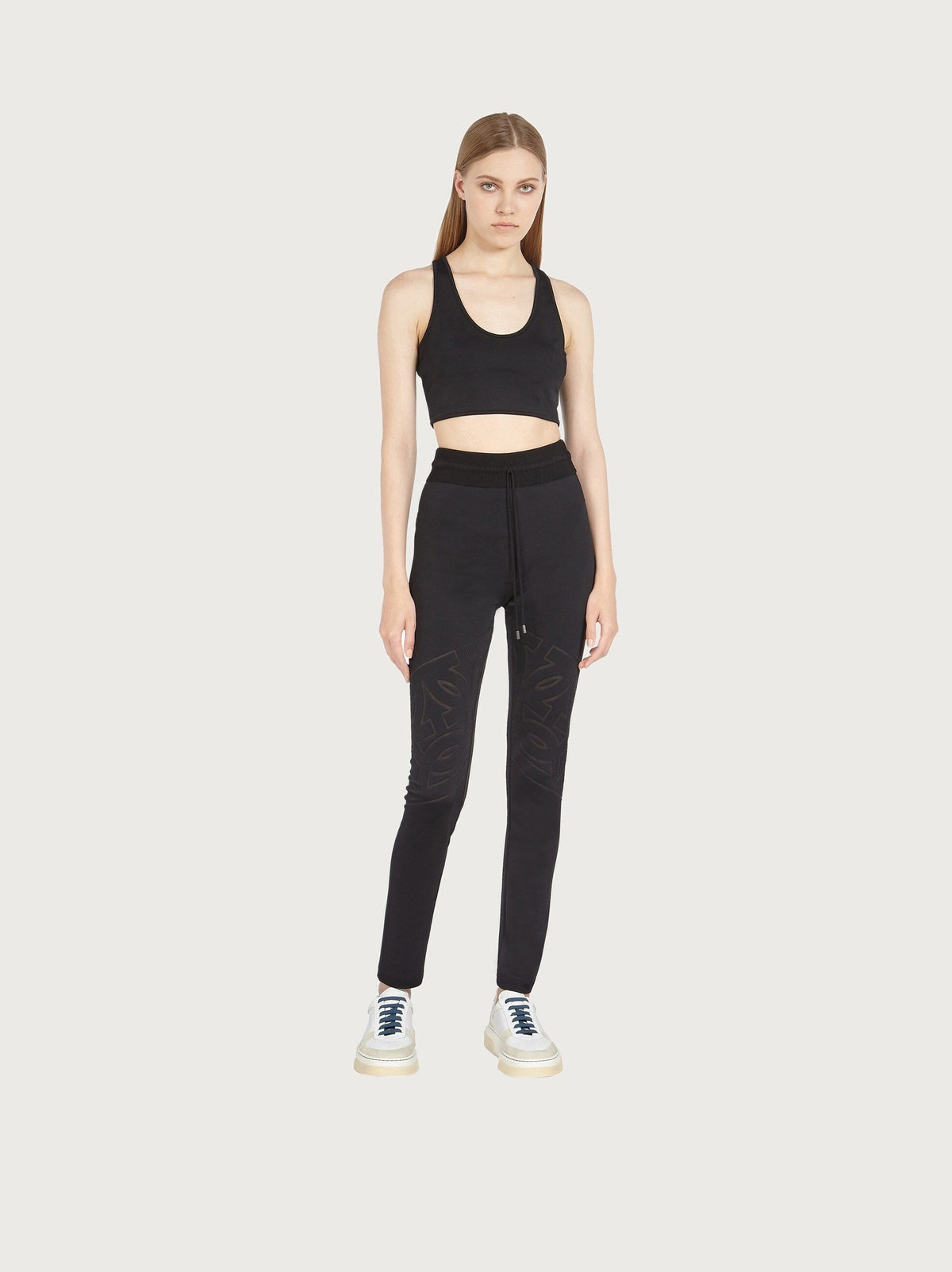 Black Salvatore Ferragamo crop top with tonal logo mesh panel, close-up