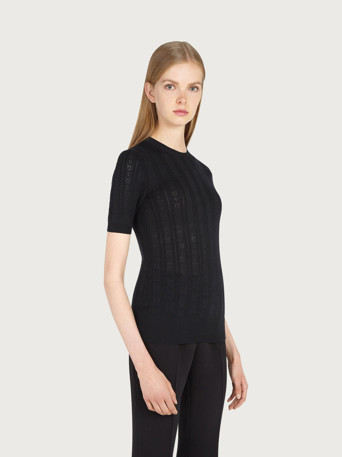 Detail view of micro ajour Gancini pattern on Salvatore Ferragamo knit top