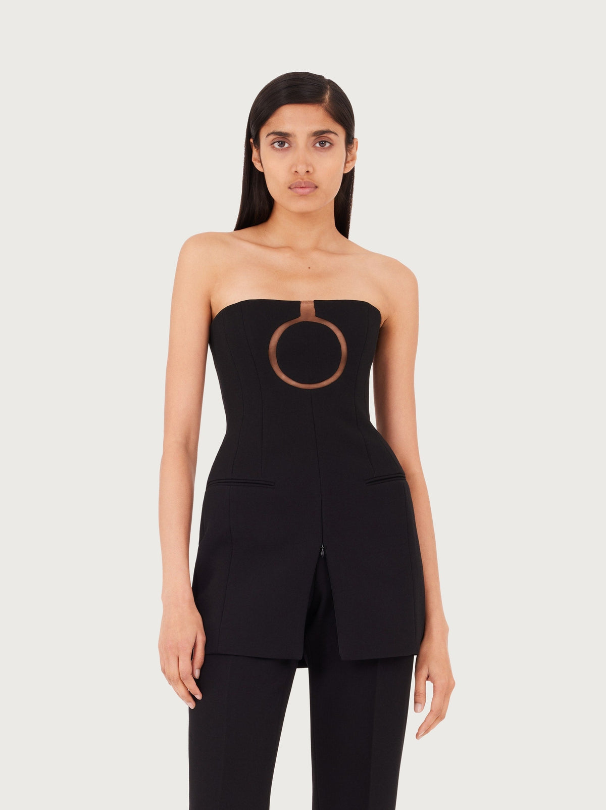 Black Salvatore Ferragamo bustier mini dress, side view showing structured bodice