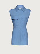 Light blue Salvatore Ferragamo sleeveless shirt, side view showing pleated hem