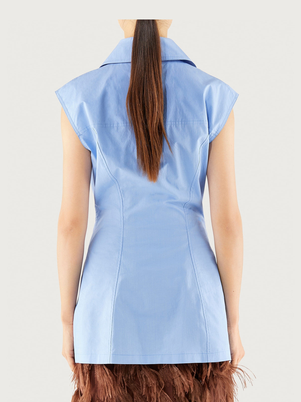 Light blue Salvatore Ferragamo sleeveless shirt, detail of chest pocket and button placket