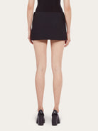 Black Salvatore Ferragamo wool mini skirt, side view showing welt pocket
