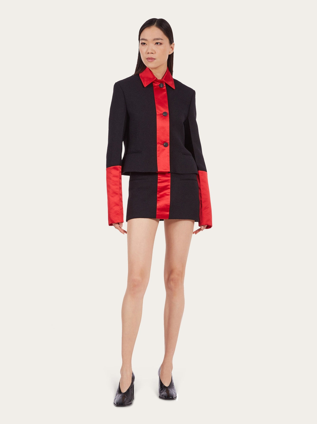 Black Salvatore Ferragamo wool mini skirt, close-up of double welt pocket