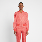 Red and coral Salvatore Ferragamo bomber jacket with white chain print, front view