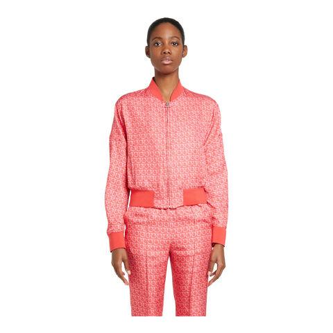 Salvatore Ferragamo bomber jacket detail showing white chain print on red coral fabric