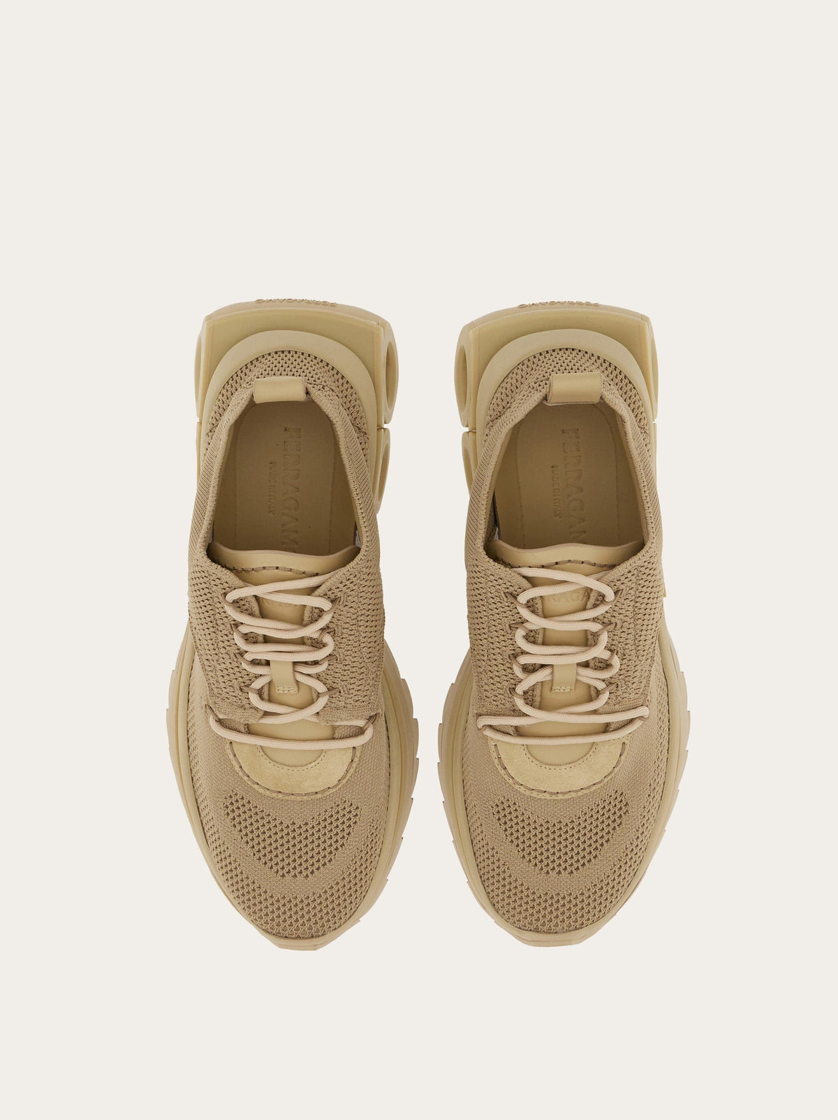 Beige Salvatore Ferragamo knit sneaker with lace-up closure, front angle