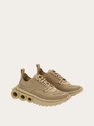 Beige knit sneaker by Salvatore Ferragamo with rubber sole, bottom view