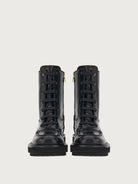 Black Salvatore Ferragamo combat boots, front angle view