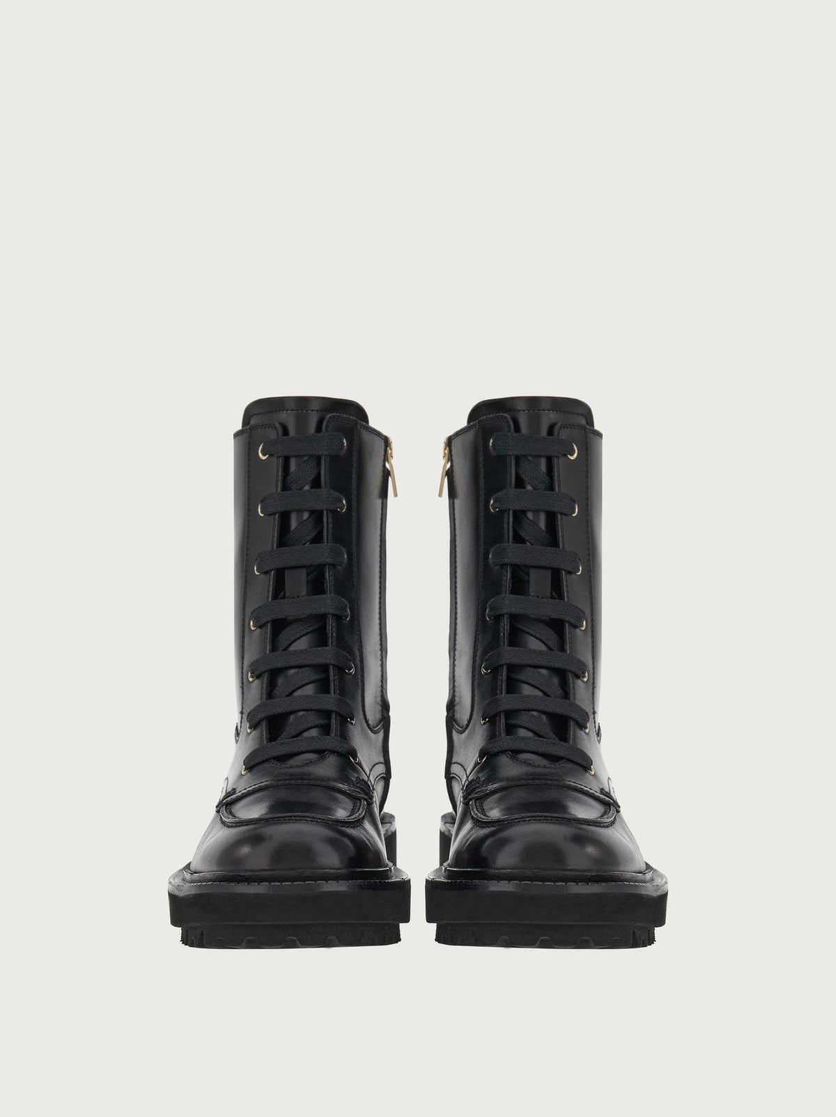Black Salvatore Ferragamo combat boots, front angle view