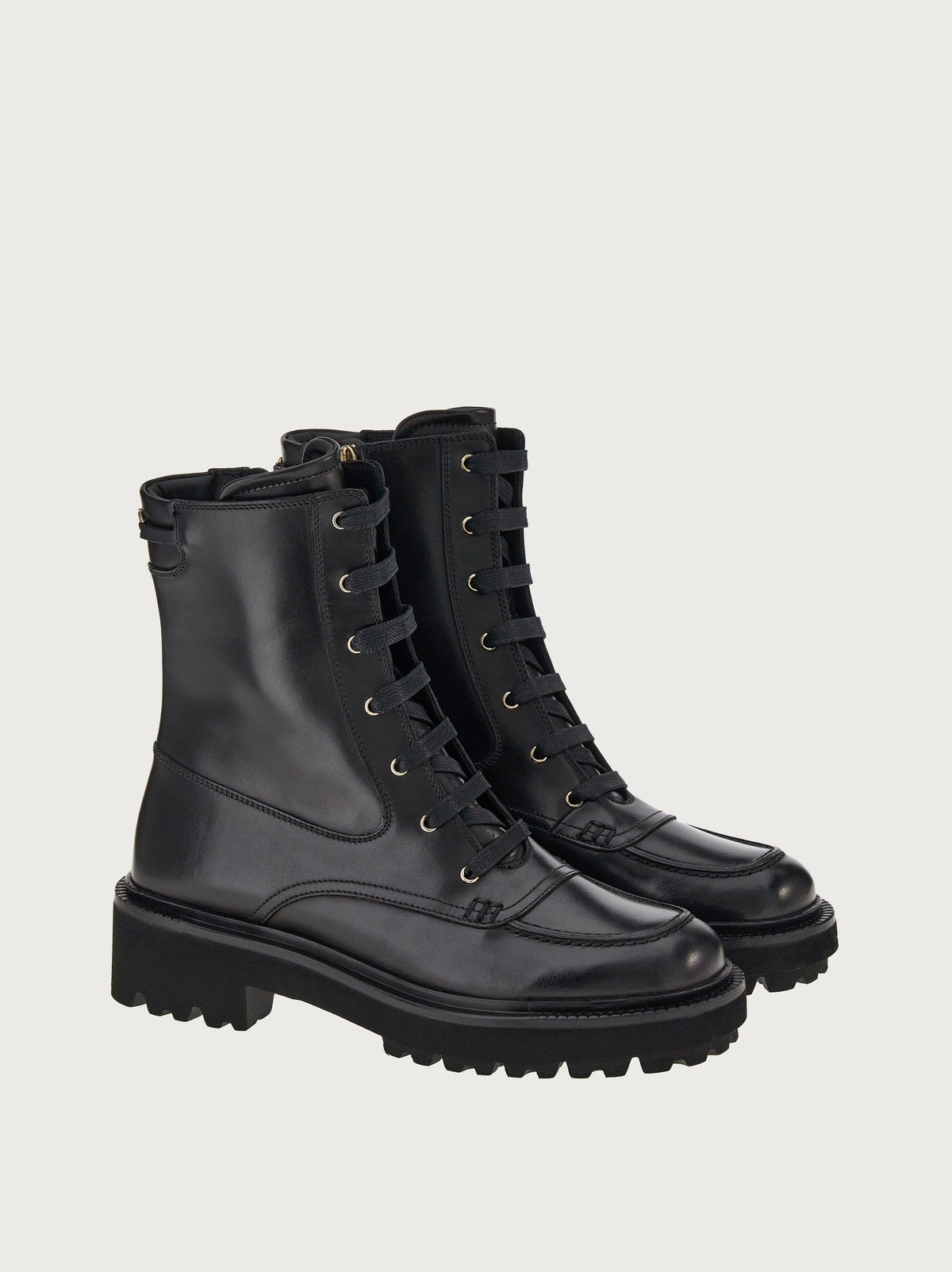 Black calf leather combat boots by Salvatore Ferragamo, three-quarter view