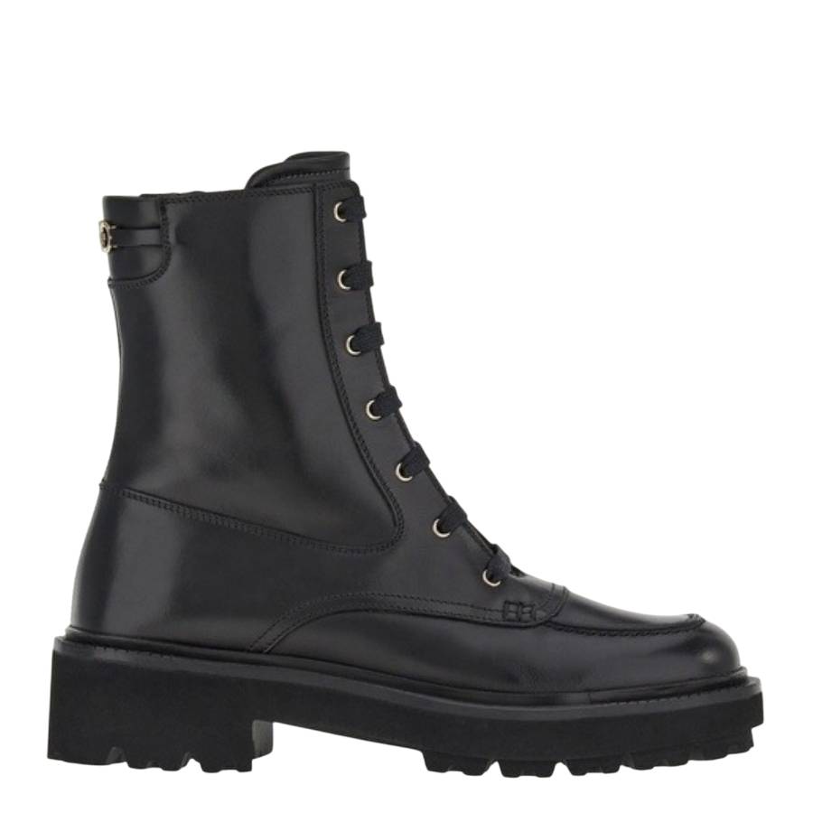 Black combat boots with round toe by Salvatore Ferragamo, detail of lace-up closure