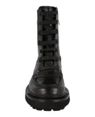 Black combat boots by Salvatore Ferragamo, detail of heel and back counter