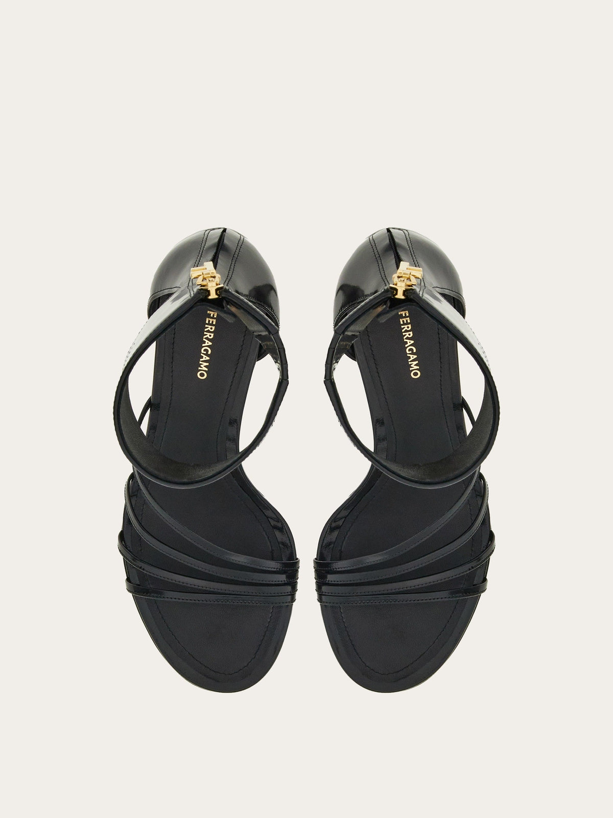 Black Salvatore Ferragamo Clethra sandals showing sculptured hand-painted heel detail
