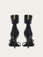 Black Salvatore Ferragamo Clethra sandals showing alligator-print insole detail