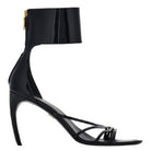 Black Salvatore Ferragamo Clethra sandals showing curved heel profile and sole