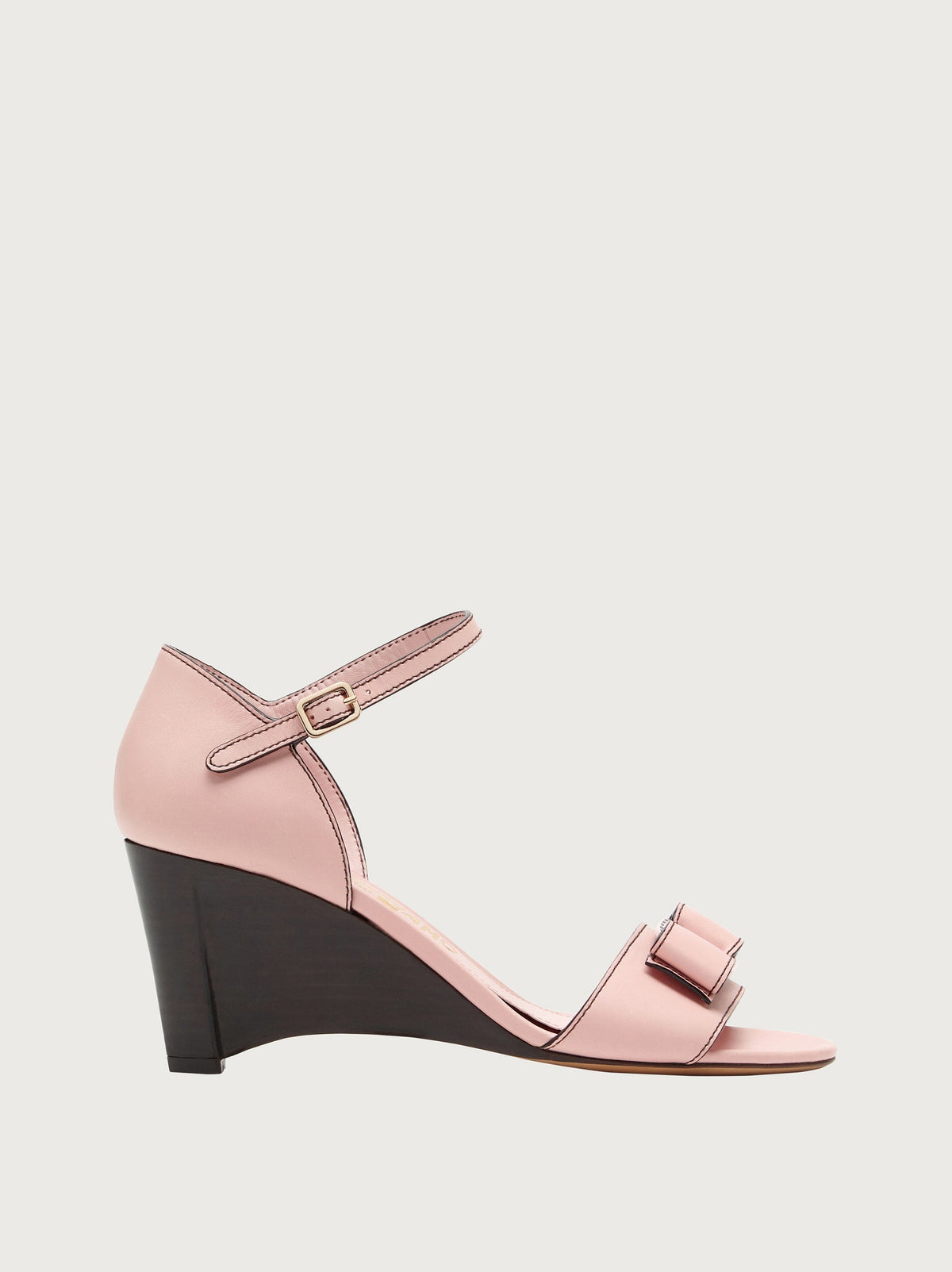 Light pink leather wedge sandal with bow detail, side view by Salvatore Ferragamo