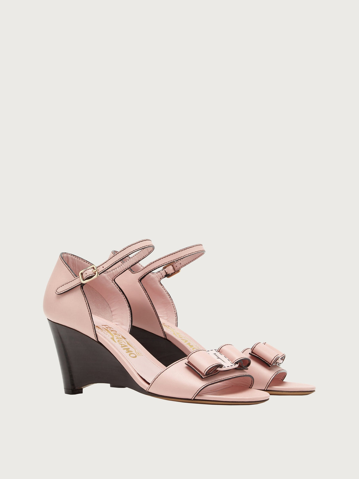 Light pink Salvatore Ferragamo wedge sandal, front view showing vamp bow
