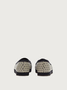 Cream monogram jacquard ballet flat with gold-tone hardware charm, top view