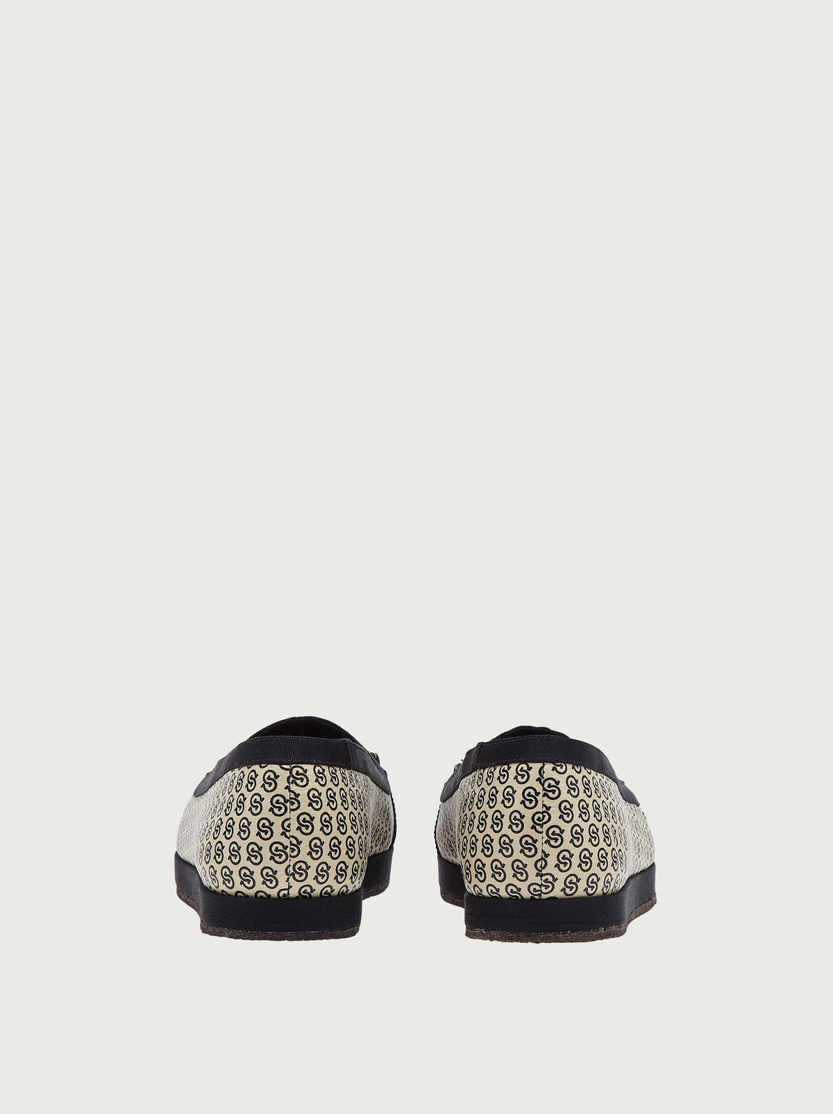 Cream monogram jacquard ballet flat with gold-tone hardware charm, top view