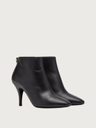 Black Salvatore Ferragamo ankle bootie with Gancini hardware, back view