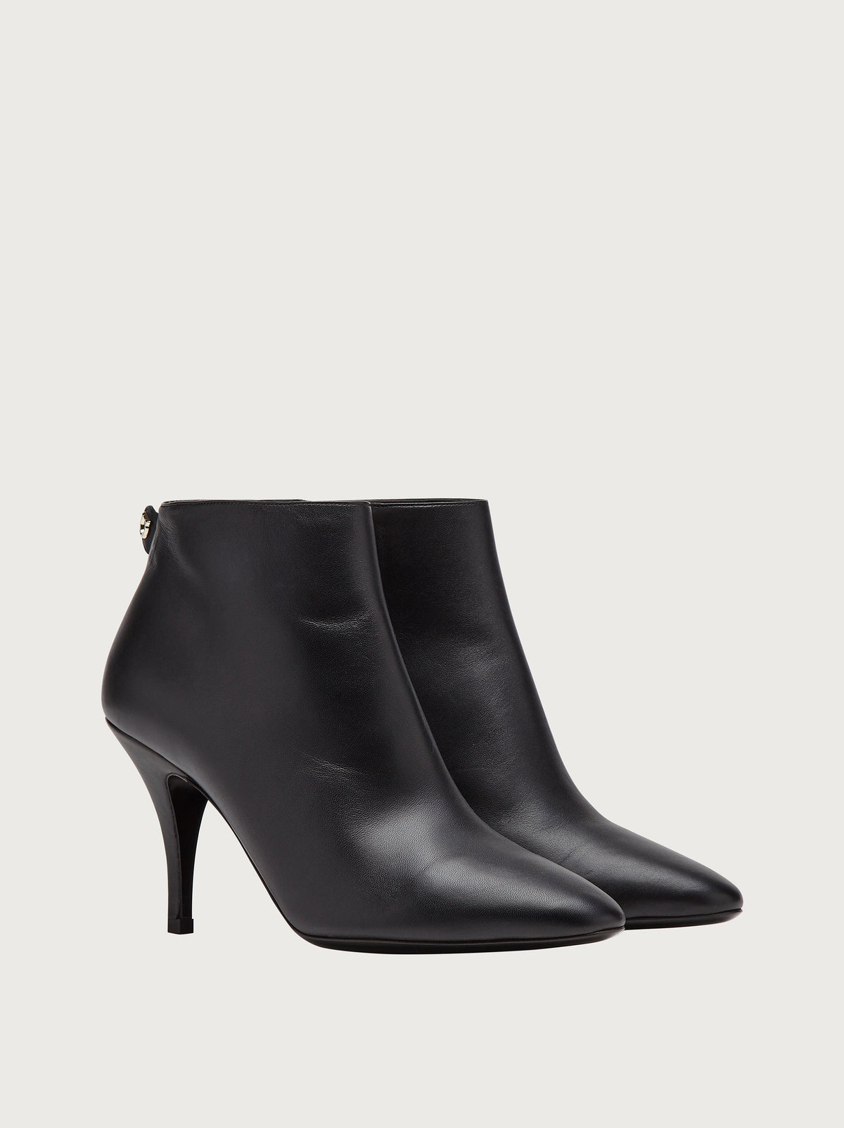 Black Salvatore Ferragamo ankle bootie with Gancini hardware, back view