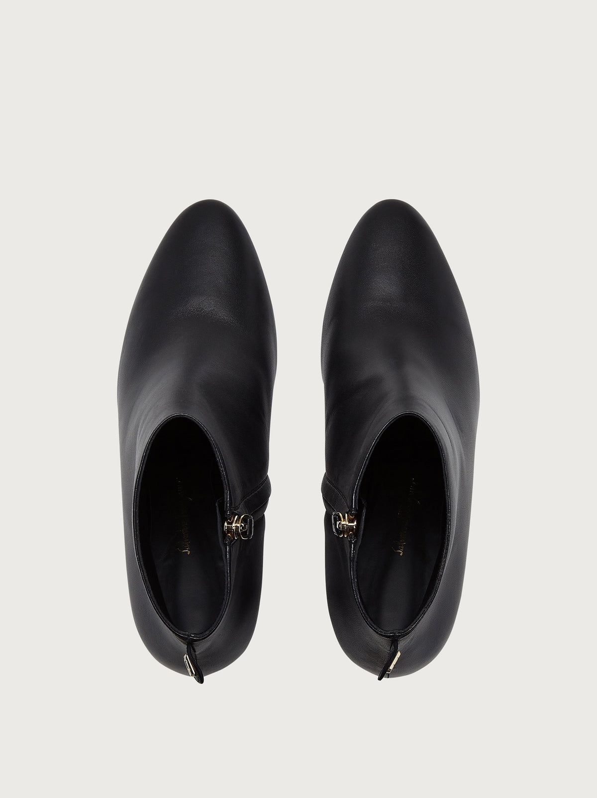 Black Salvatore Ferragamo leather bootie with pointed toe, detail view