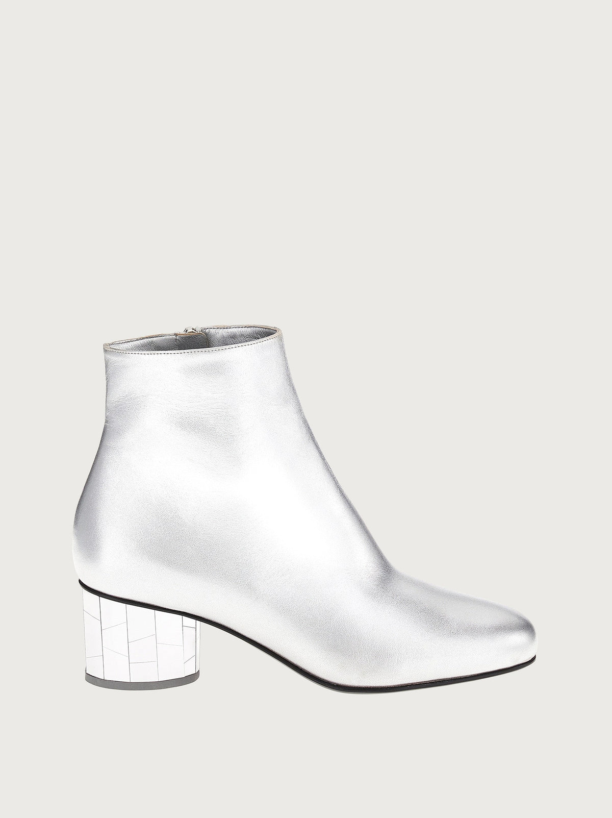 Metallic silver leather ankle bootie with mirrored block heel by Salvatore Ferragamo, side view