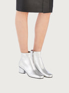 Metallic silver leather bootie by Salvatore Ferragamo, front view