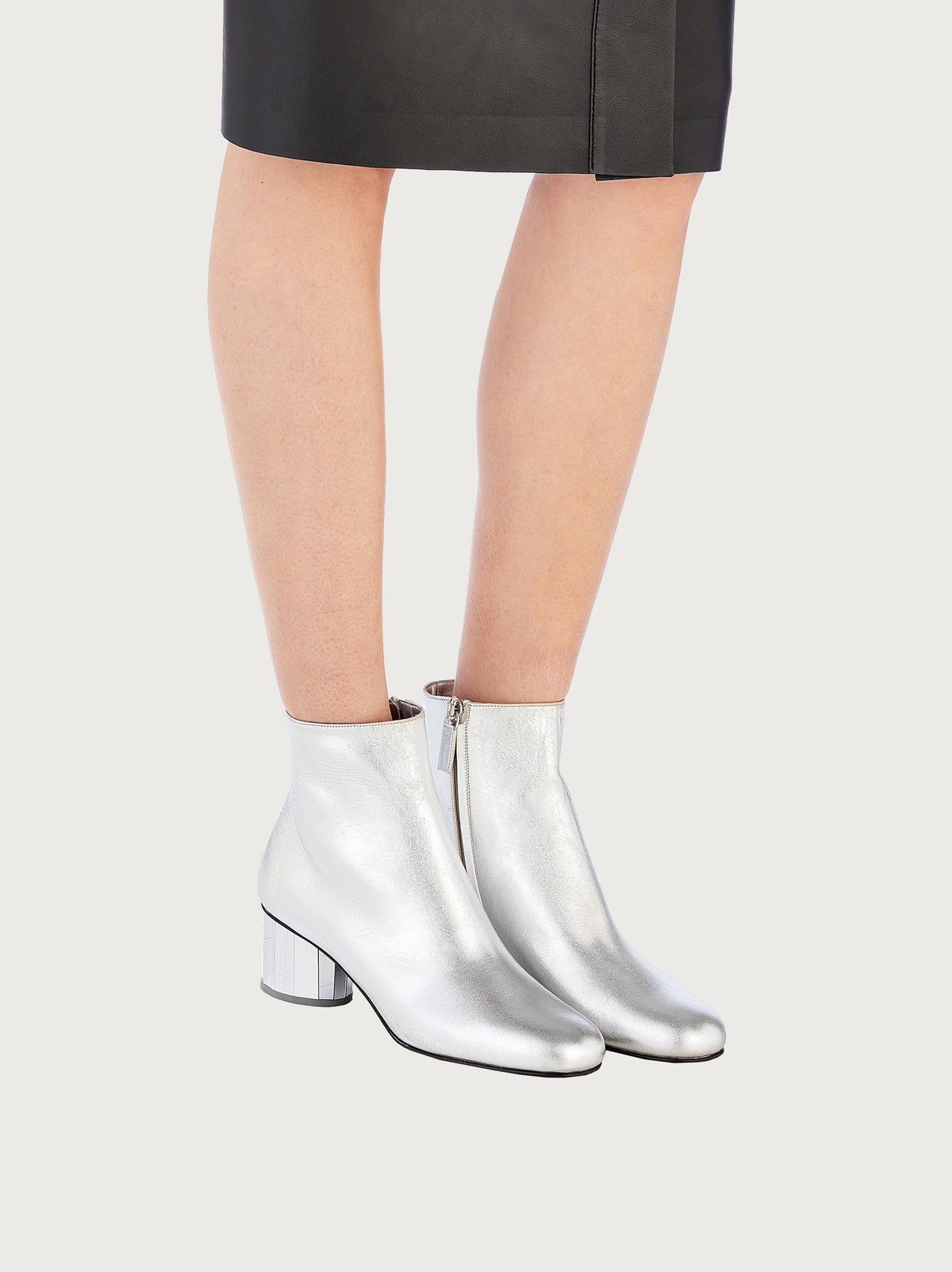 Metallic silver leather bootie by Salvatore Ferragamo, front view